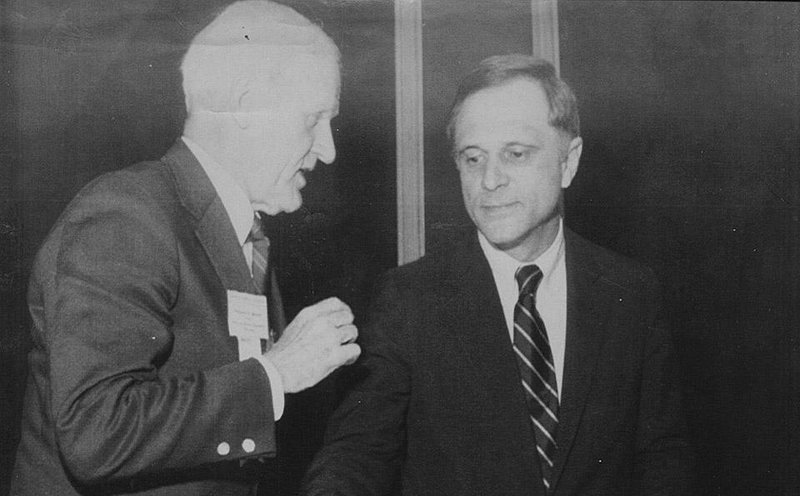 Former U.S. Sen. David Pryor (right) listens to William H. Bowen, then-president of the Arkansas Banking Association, after the senator spoke to the group on May 16, 1983. 