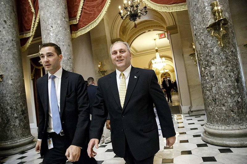 House Majority Whip Steve Scalise (right) of Louisiana leaves the House chamber after a vote there approved legislation authorizing the Keystone XL oil pipeline. The Democrat-led Senate will take up the measure Tuesday.