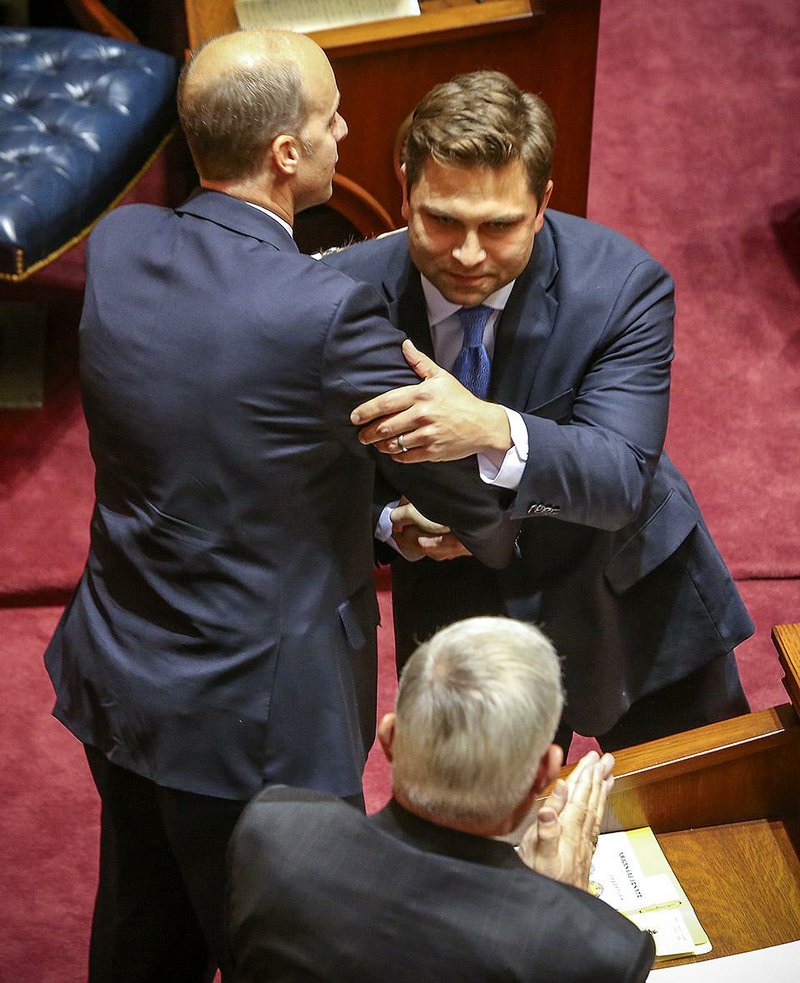 State Sen. Jake Files, R-Fort Smith, (left) congratulates Sen. Jonathan Dismang, R-Searcy, after Dismang’s election as Senate president pro tempore Friday at the Capitol in Little Rock. 