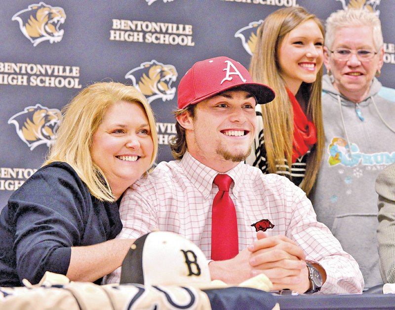  STAFF PHOTO BEN GOFF &#8226; @NWABenGoff Cody Scroggins poses for pictures with his mother Kerrie Scroggins after signing his national letters of intent to play baseball for Arkansas during a ceremony Friday in Bentonville&#8217;s Tiger Athletic Complex.