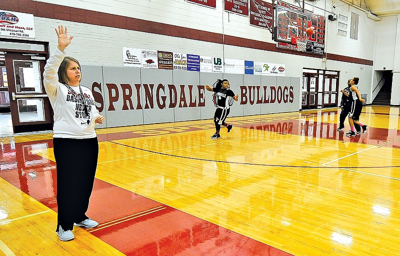  Staff Photo J.T. Wampler Heather Hunsucker, Springdale High girls basketball coach, conducts practice Thursday at the school.