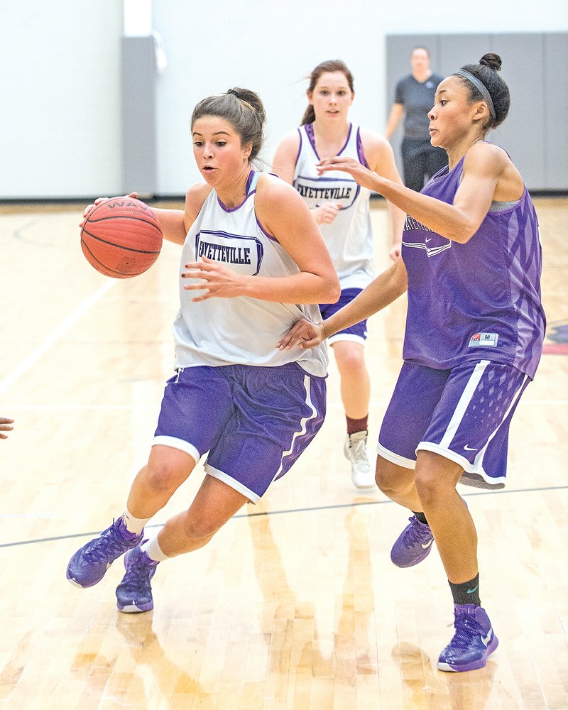 STAFF PHOTO ANTHONY REYES &#8226; @NWATONYR Sydney Crockett, Fayetteville senior, drives to the basket during drills last Tuesday at Bulldog Arena. Crockett is one of several returning letter winners of a Lady Bulldogs team that won the 7A-West Conference in the 2013-14 season.