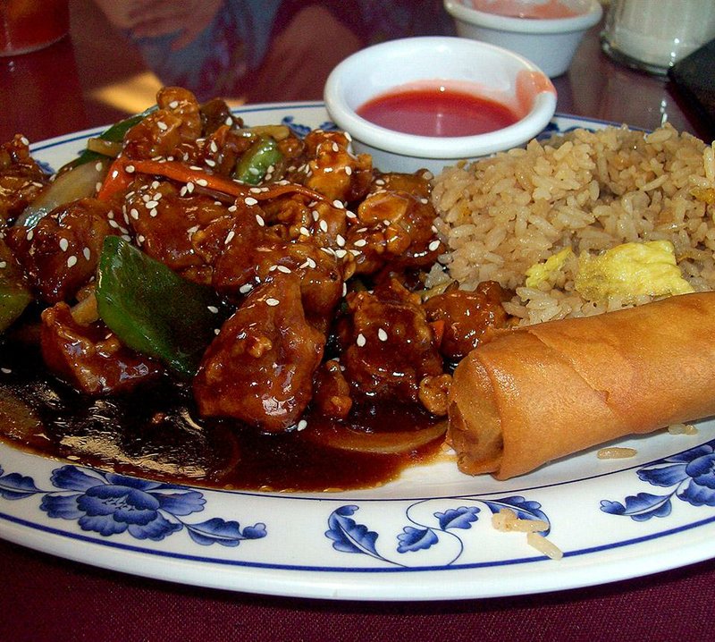 The Sesame Chicken at Emily’s Diner in Jacksonville comes with rice and a spring roll.