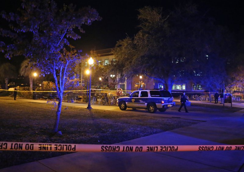 Police investigate a shooting at Strozier Library on Florida State campus on Thursday, Nov. 20, 2014, in Tallahassee, Fla.