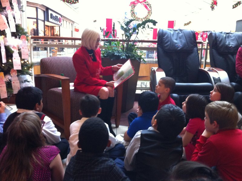 First Lady Ginger Beebe reads a Christmas story to the Sherwood Elementary School Choir as part of The Salvation Army's 2014 Christmas Kick-Off at Park Plaza Mall.