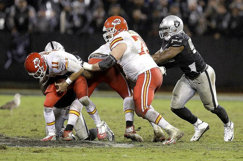Sio Moore’s sack of Kansas City Chiefs quarterback Alex Smith (11) prompted an early celebration that could have cost the Oakland Raiders their first victory in more than a year.
