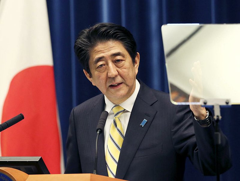 Japan's Prime Minister Shinzo Abe speaks during a press conference at his official residence in Tokyo Friday, Nov. 21, 2014. Abe dissolved the lower house of Japan’s parliament earlier on Friday, forcing a snap election in an apparent bid to shore up support for his scandal-plagued government so that he can pursue his policy goals. (AP Photo/Koji Sasahara)