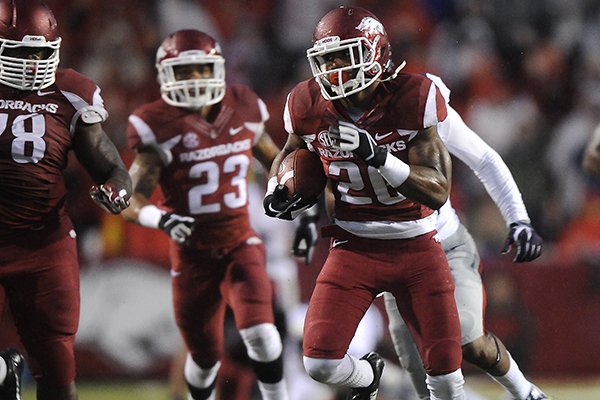 Arkansas safety Rohan Gaines returns an interception for a touchdown during a game against Ole Miss on Saturday, Nov. 22, 2014 at Razorback Stadium in Fayetteville. 