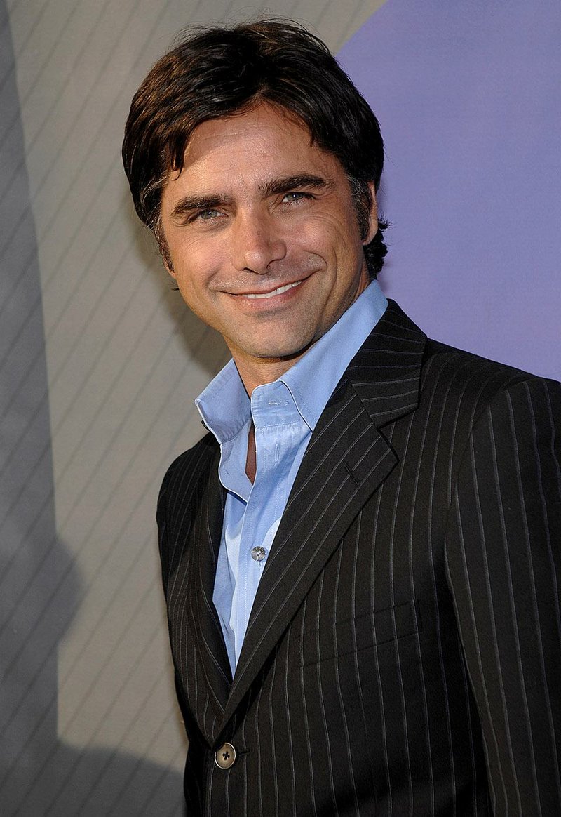** FILE ** Actor John Stamos attends the NBC All-Star Party Tuesday, July 17, 2007 in Beverly Hills, Calif. Stamos played uncle Jesse on the '80s sitcom "Full House." Now he wants to be a father. "If I don't have kids soon, I am going to adopt," the 44-year-old actor tells OK! magazine in its latest issue, on newsstands Friday, Oct. 5, 2007. "Even if I do have kids, I think I will (adopt). I always thought to myself that I would be a better father later on in life." (AP Photo/Phil McCarten)