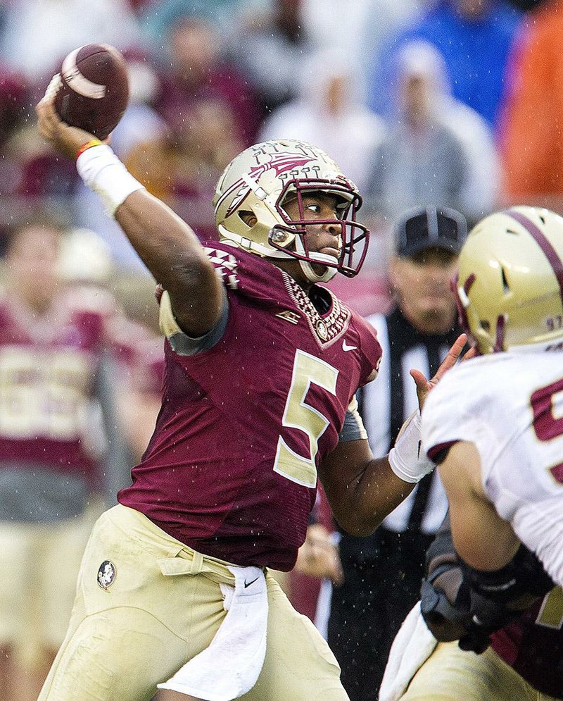 Florida State quarterback Jameis Winston throws in the first half of an NCAA college football game against Boston College in Tallahassee, Fla., Saturday, Nov. 22, 2014.  Florida State defeated Boston College 20-17.  (AP Photo/Mark Wallheiser)