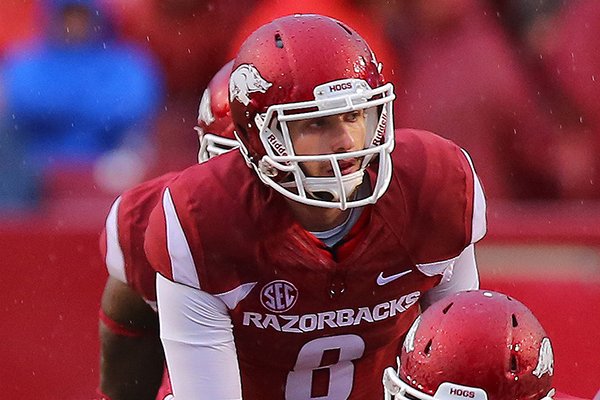 Arkansas quarterback Austin Allen takes a snap during a game against Ole Miss on Saturday, Nov. 22, 2014 at Razorback Stadium in Fayetteville. 