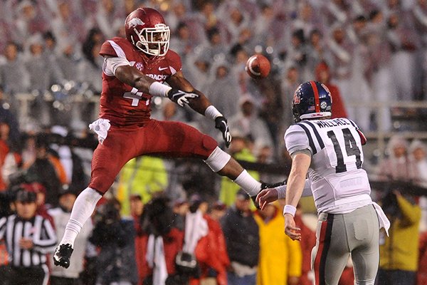 Arkansas linebacker Martrell Spaight pressures Ole Miss quarterback Bo Wallace during a game Saturday, Nov. 22, 2014 at Razorback Stadium in Fayetteville. 