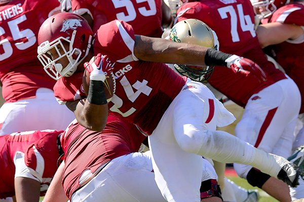 Arkansas running back Kody Walker carries the ball during a game against UAB on Saturday, Oct. 25, 2014 at Razorback Stadium in Fayetteville. 