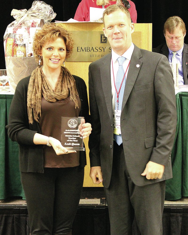 Submitted Photo Leah Queen received an award from Brett Stone, the 2013/2014 ArkAhperd president.