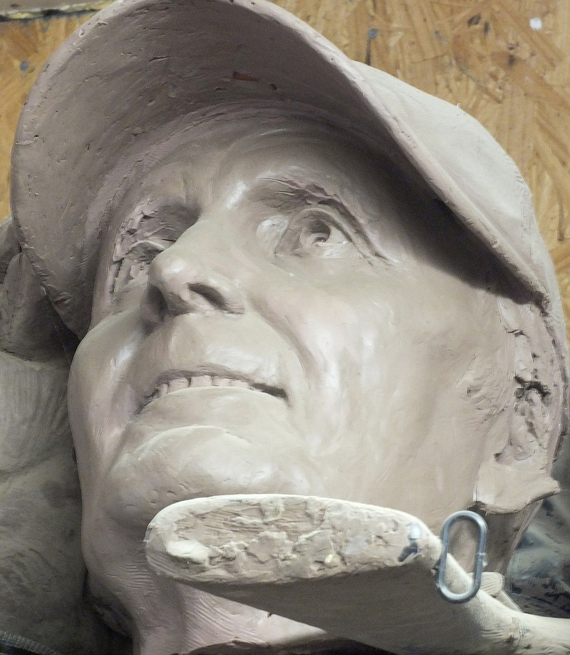 The face of John McDonnell in clay oversees the work in the studio in Garfield.