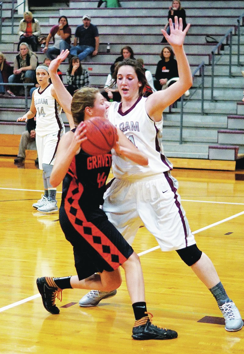 Photo by Randy Moll Gravette&#8217;s Sydney Hicks looks to shoot but is blocked by Baily Cameron during play between Siloam Springs and Gravette in the Panther Arena on Thursday.
