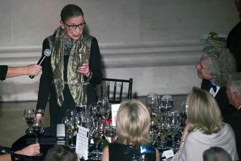 AP FILE PHOTO - Supreme Court Associate Justice Ruth Bader Ginsburg gives a toast during the New Republic Centennial Gala Dinner at the Andrew Mellon Auditorium in Washington, Wednesday, Nov. 19, 2014. 