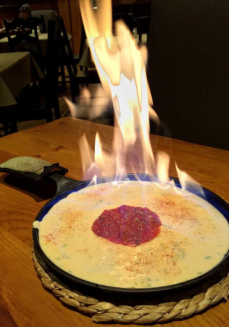 The Grilled Queso and Chips consists of “Flaming Yucatan Peninsula Cheese Dip” at MarketPlace Grill in Little Rock.