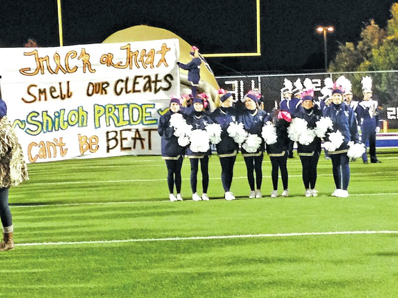 COURTESY PHOTO Shiloh Christian cheerleaders came up with a creative sign for the Oct. 31 home game vs. Gravette on Halloween night. Paper run-through signs are not as commonplace as they once were before inflatable mascots and vinyl banners. But some schools still cling to the tradition of painting signs each week to boost school and team spirit.