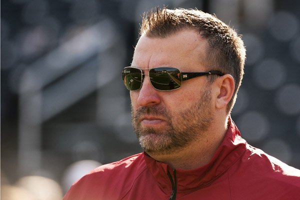 Arkansas head coach Bret Bielema watches his team warm up before the start of an NCAA college football game against Missouri Friday, Nov. 28, 2014, in Columbia, Mo. (AP Photo/L.G. Patterson)