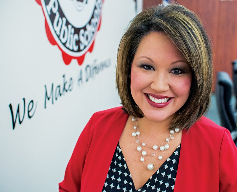 Liz Massey stands in the boardroom at the administration building of the Cabot School District in this 2014 file photo.