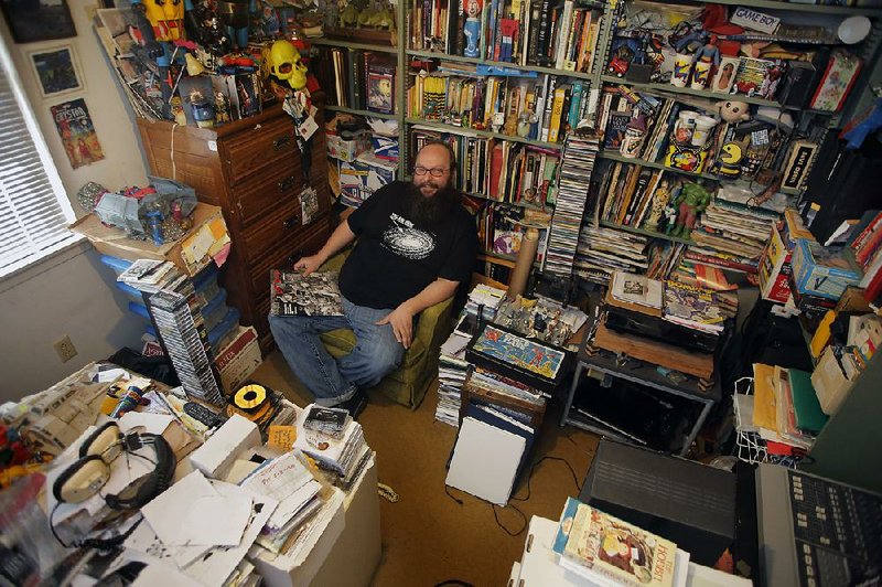 Harold Ott, founder of Psych of the South, listens to records in his childhood bedroom, where he also stores nonmusical collections. He jokes about being a hoarder, but he says, “I couldn’t do this without hoarders.”