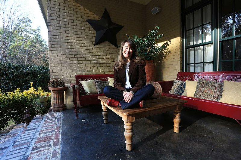 Gina Marchese on the porch of her home that is part of her backyard, her favorite space in her Little Rock home.