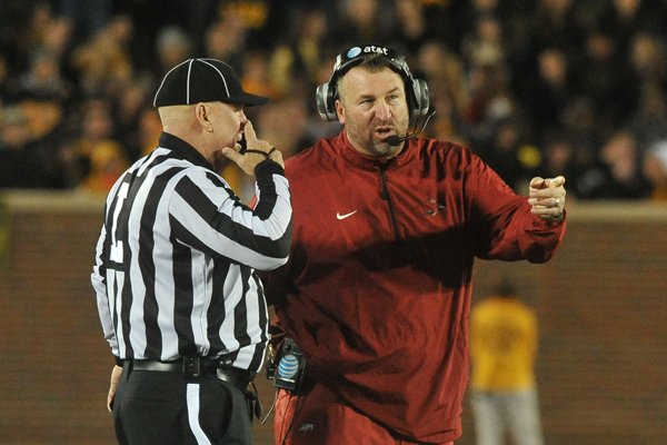 Arkansas coach Bret Bielema talks to an official during the second half of a game against Missouri on Friday, Nov. 28, 2014 at Faurot Field in Columbia, Mo. 