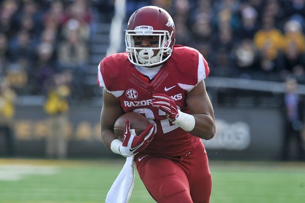 Arkansas running back Jonathan Williams scores a touchdown during the first quarter of a game against Missouri on Friday, Nov. 28, 2014 at Faurot Field in Columbia, Mo. 