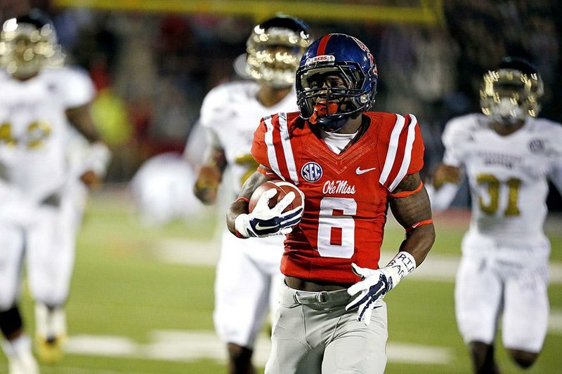 Mississippi running back Jaylen Walton (6) runs past a number of Mississippi State defenders for a 91-yard touchdown in the third quarter of the Rebels’ 31-17 upset victory.