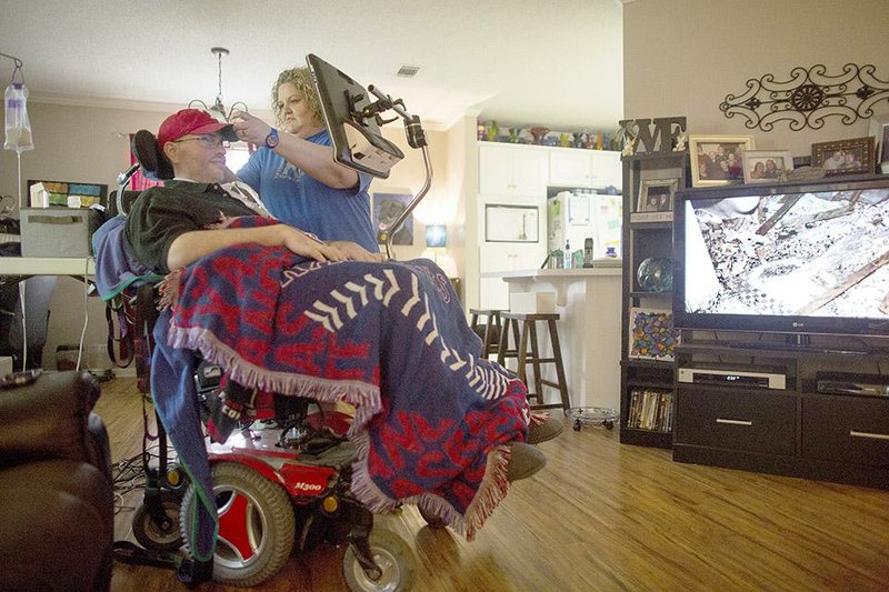 Kip Jackson and his wife, Robin, live in Sherwood. Kip has lost the ability to move his body, speak or breathe on his own, but Robin says, “He’s still so funny — so funny and charming.”