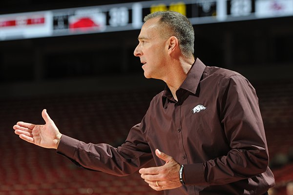 Arkansas coach Jimmy Dykes motions to his players during a game against Savannah State on Sunday, Nov. 16, 2014 at Bud Walton Arena in Fayetteville. 