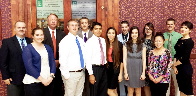 Submitted Photo Gravette High School representatives at the Economics Arkansas luncheon at the John Q. Hammons Center in Rogers were Bob Johnson, marketing/media teacher and DECA sponsor (left); Amy Roberts, economics; Richard Page, superintendent of schools; Trey Nunnally, Zach Sheridan, Roberto Garcia, Emma Roman, Brandon Hindal, Ariana Rogers, Miranda Mendoza, Angela Lee; Randal Hunt, GHS vice principal; and Kara Smith. Bill Hayford, CFO of Gravette School District, and Jace Russ attended but are not pictured.