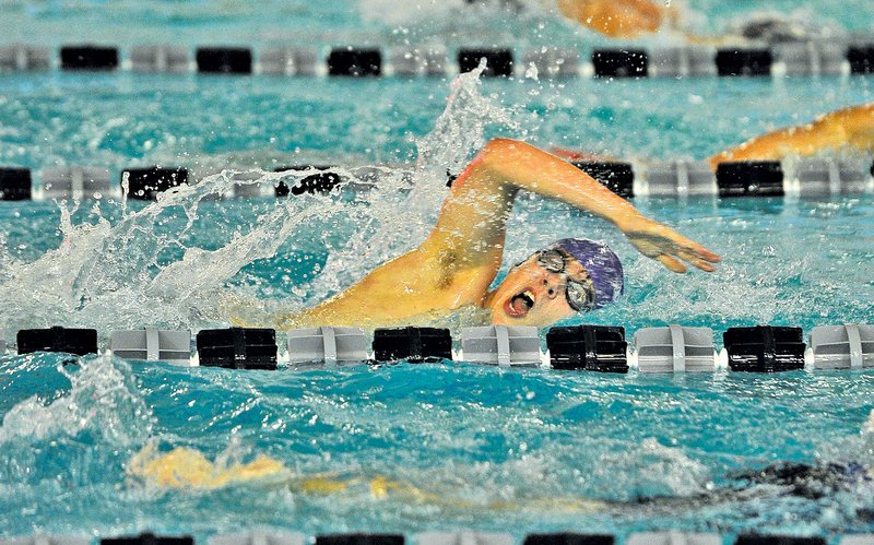  Staff Photo Michael Woods &#8226; @NWAMICHAELW Trevor Walker, Fayetteville swimmer, competes in the boys 200-yard freestyle Wednesday at the Fayetteville Holiday Invitational swim meet at The Jones Center in Springdale.