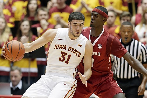 Iowa State forward Georges Niang, left, drives around Arkansas forward Bobby Portis during the first half of an NCAA college basketball game, Thursday, Dec. 4, 2014, in Ames, Iowa. (AP Photo/Charlie Neibergall)