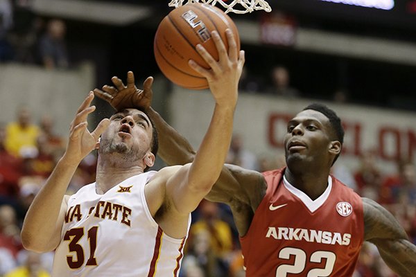 Iowa State forward Georges Niang, left, is fouled by Arkansas forward Jacorey Williams (22) while driving to the basket during the second half of an NCAA college basketball game, Thursday, Dec. 4, 2014, in Ames, Iowa. (AP Photo/Charlie Neibergall)