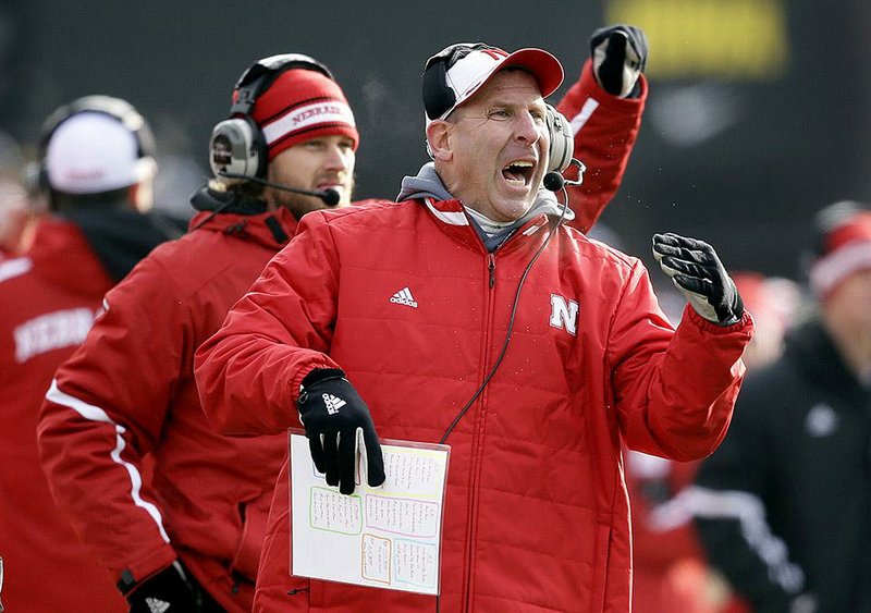 Former Nebraska Coach Bo Pelini got some help from a friend when he met with the Cornhuskers for a final time Tuesday night.