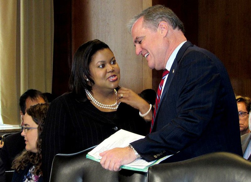 Arkansas Public Service Commission Chairman Colette Honorable talks with U.S. Sen. Mark Pryor, D-Ark., before testifying Thursday at a Senate committee hearing on her nomination to the Federal Energy Regulatory Commission. 