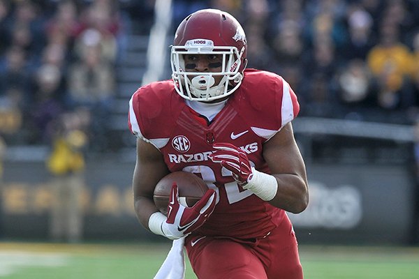 Arkansas running back Jonathan Williams carries the ball during a game against Missouri on Friday, Nov. 28, 2014 at Faurot Field in Columbia, Mo. 