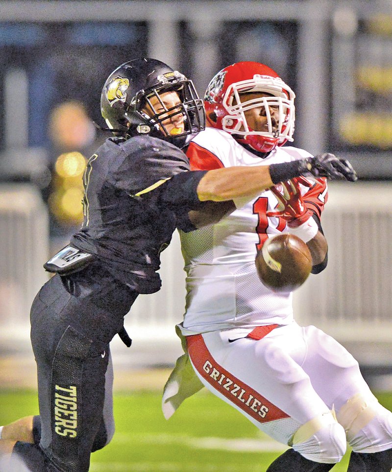  STAFF PHOTO BEN GOFF &#8226; @NWABenGoff Hayden McDaniel, left, Bentonville defensive back, breaks up a pass intended for Tyler Triplett, Fort Smith Northside wide receiver, to force a fourth down during their Oct. 3 game in Bentonville&#8217;s Tiger Stadium.
