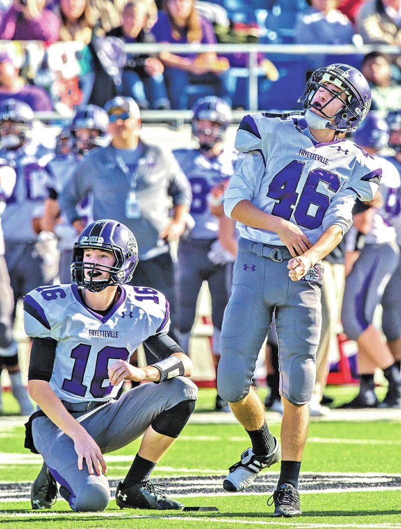 STAFF PHOTO JASON IVESTER Jack Lindsey, left, Fayetteville junior, and senior kicker Cal Conway watch Saturday as Conway&#8217;s field-goal attempt misses against Bentonville in the Class 7A championship game at War Memorial Stadium in Little Rock. More photos at nwaonline.com/photos.