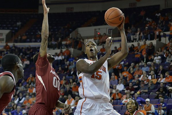 Clemson's Donte Grantham, front right, shoots while pressured by Arkansas's Rashad Madden during the first half of an NCAA college basketball game Sunday, Dec. 7, 2014, at Littlejohn Coliseum in Clemson, S.C. (AP Photo/Richard Shiro)