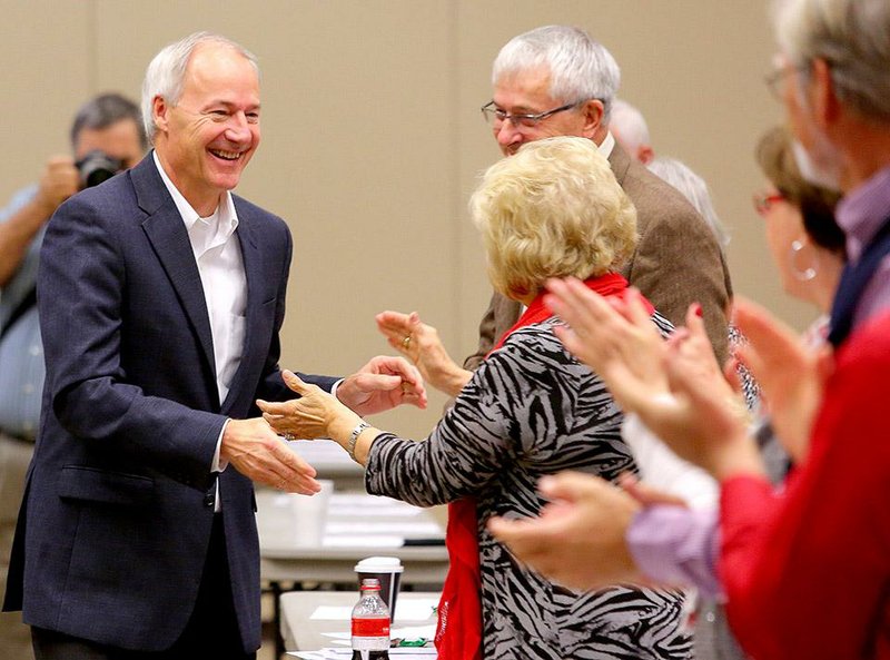 12/6/14
Arkansas Demorcrat-Gazette/STEPHEN B. THORNTON
Gov.-elect Asa Hutchinson greets supporters as he is introduced to speak at Saturday's Arkansas Republican Party Winter State Committee meeting Benton Event Center in Benton.