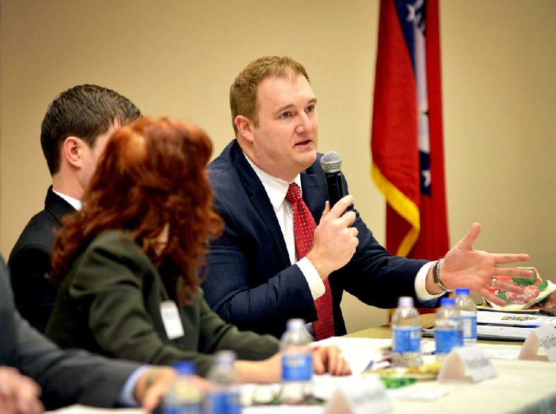 Jesse Wiese, policy analyst with Justice Fellowship in Virginia, answers an audience question Tuesday during the Northwest Arkansas Public Discussion panel titled Promises: Prison, Parole and Probation at the Shewmaker Center for Workforce Technologies at Northwest Arkansas Community College in Bentonville.