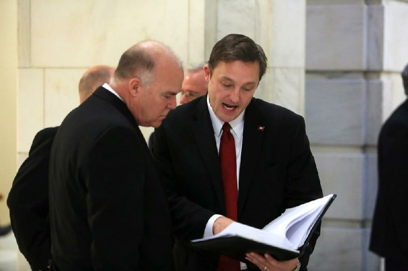 Arkansas House Speaker-designate Jeremy Gillam, R-Judsonia (right), speaks Tuesday with state Rep. Joe Jett, D-Success, at the state Capitol in Little Rock. Lawmakers held organizational meetings for the Joint Budget and Joint Audit committees and for the Arkansas Legislative Council.