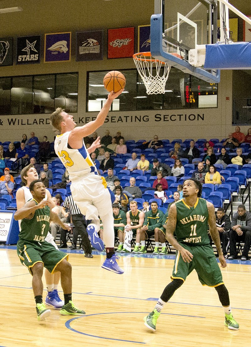 Nathan Marquardt/JBU Sports Information John Brown junior D.J. Feitl scored 25 points in the Golden Eagles&#8217; 78-77 win against Oklahoma Baptist on Saturday at Bill George Arena.