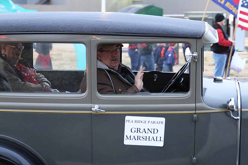 Photograph courtesy of Russ Wilson Grand marshal Police Chief Tim Ledbetter and his wife, Teresa, joined Charles and Alice Crabtree in the Model A Ford in the annual Christmas Parade Saturday.