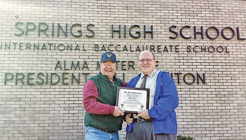 Mike Vincent of Hot Springs, right, accepts the Arkansas State Air Force Association Teacher of the Year award from Larry C. Louden of Hot Springs, president of the Lewis E. Lyle Chapter of the Air Force Association of Arkansas in Hot Springs and past president of the state organization. Vincent is the former EAST facilitator at Hot Springs High School; he is now employed with the Arkansas Department of Education.