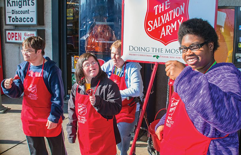 Jake Johnston, from left, Lexi Grissom, Patricia Braswell and Benay Dodson ring bells for The Salvation Army in Cabot as they volunteer their time through the Lonoke Exceptional Development Center.