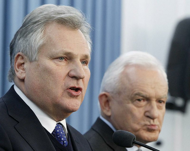 Former Polish President Aleksander Kwasniewski (left) and Leszek Miller, former prime minister, speaking Wednesday in Warsaw, acknowledged after years of denials that they had allowed a secret CIA prison inside Poland but said they did not authorize torture. 